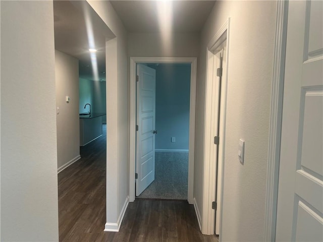 hallway featuring dark hardwood / wood-style floors