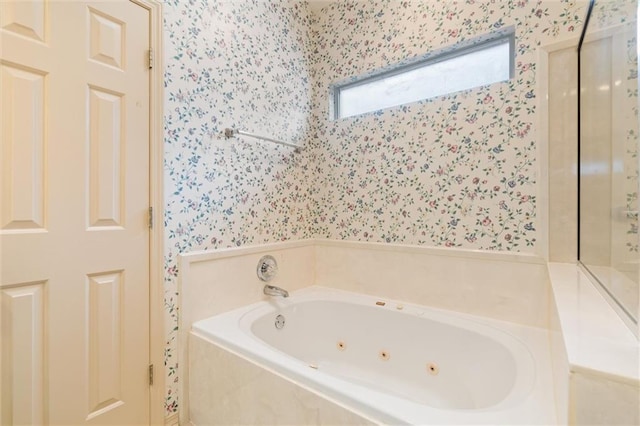 bathroom featuring a relaxing tiled tub