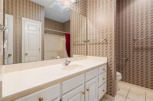 bathroom with walk in shower, tile patterned floors, toilet, and vanity