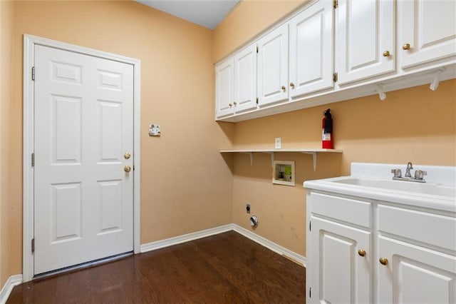 laundry area with sink, cabinets, dark hardwood / wood-style floors, hookup for a washing machine, and electric dryer hookup