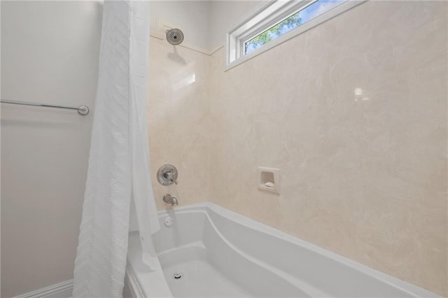 bathroom with shower / bath combo