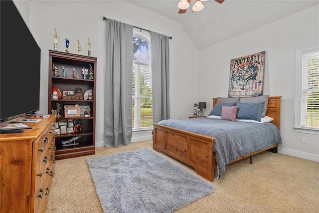 bedroom featuring carpet floors, lofted ceiling, baseboards, and multiple windows