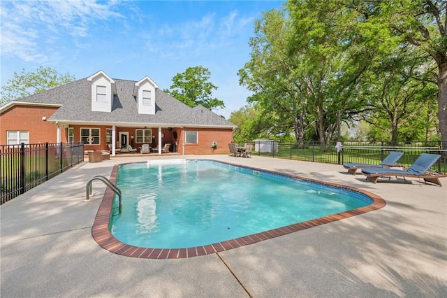 view of pool featuring fence, a fenced in pool, and a patio