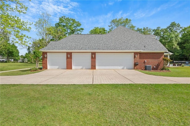 exterior space with brick siding, a yard, and central AC