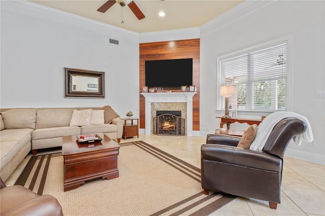 living area with crown molding, light tile patterned flooring, and visible vents