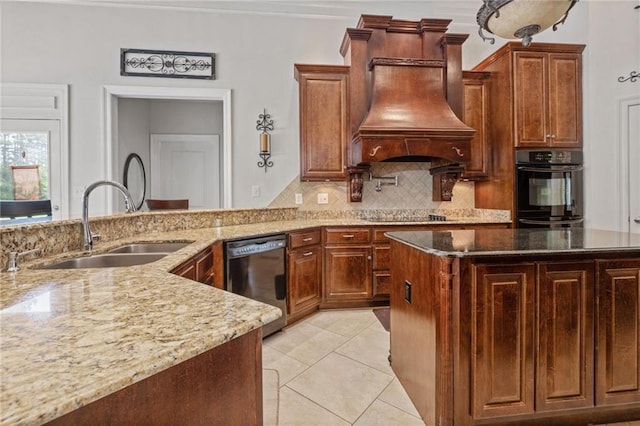 kitchen with light stone counters, dishwasher, a sink, black electric stovetop, and custom exhaust hood