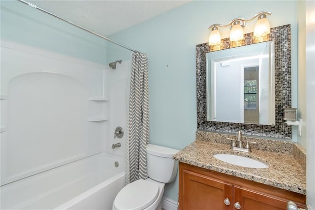 full bathroom with vanity, toilet, tasteful backsplash, and shower / bath combination with curtain