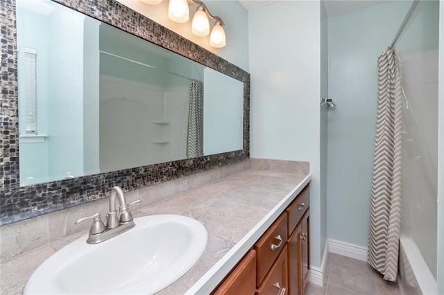 bathroom featuring vanity, decorative backsplash, shower / bath combo, and tile patterned flooring