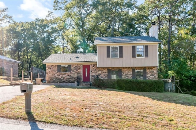 tri-level home featuring a front yard