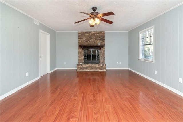 1000 Choctaw Bluff Rd, Mobile, AL 36695 - unfurnished living room featuring ornamental molding, a ceiling fan, wood finished floors, a textured ceiling, and baseboards
