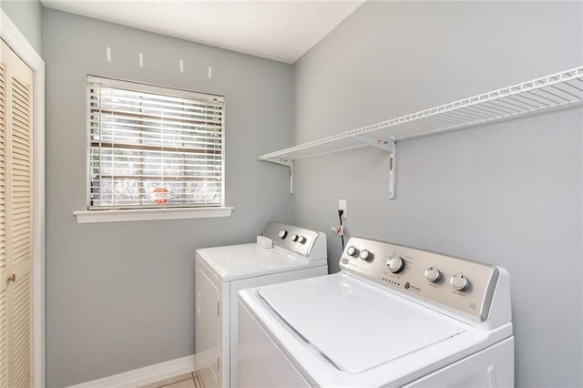 clothes washing area featuring washing machine and dryer