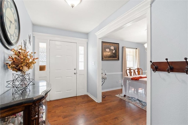 entrance foyer featuring dark hardwood / wood-style floors