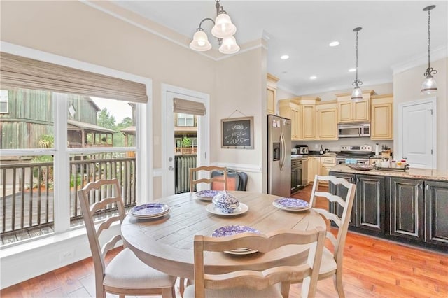 311 Magnolia Ave Unit 54, Satsuma, AL 36572 - dining space with ornamental molding, a chandelier, light wood finished floors, and recessed lighting