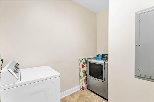 311 Magnolia Ave Unit 54, Satsuma, AL 36572 - washroom featuring washer and clothes dryer, baseboards, electric panel, and light tile patterned floors