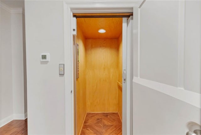 311 Magnolia Ave Unit 54, Satsuma, AL 36572 - corridor featuring elevator, baseboards, and wood finished floors