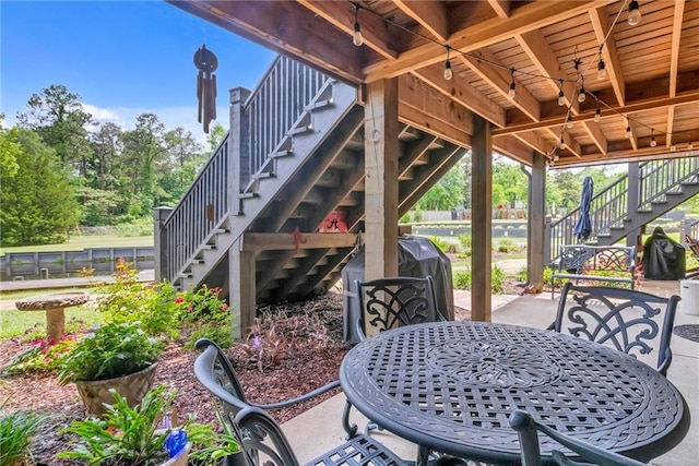 311 Magnolia Ave Unit 54, Satsuma, AL 36572 - view of patio / terrace featuring stairs and outdoor dining area