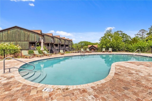 311 Magnolia Ave Unit 54, Satsuma, AL 36572 - community pool with a patio area