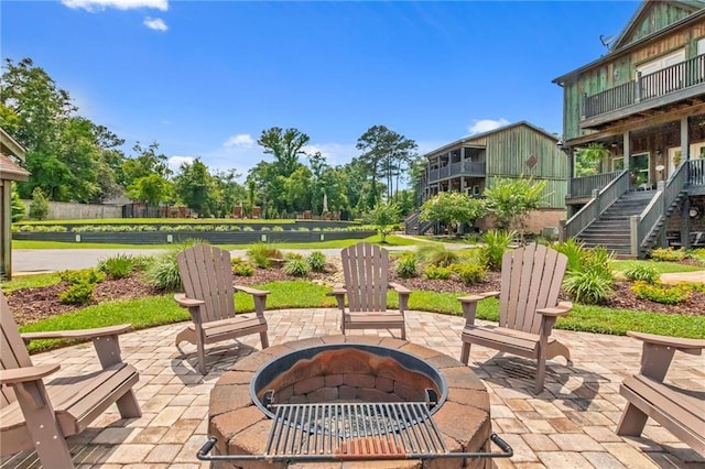 311 Magnolia Ave Unit 54, Satsuma, AL 36572 - view of patio / terrace with a fire pit and stairs