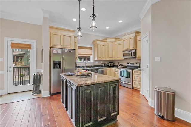 311 Magnolia Ave Unit 54, Satsuma, AL 36572 - kitchen featuring stainless steel appliances, a center island, crown molding, recessed lighting, and hanging light fixtures