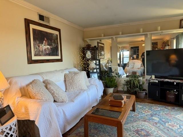 living room with ornamental molding