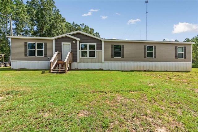 back of property featuring a lawn