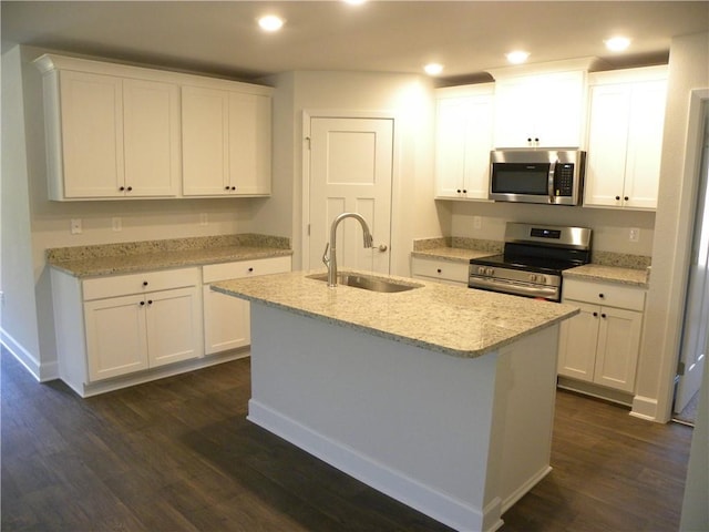 kitchen with sink, white cabinets, an island with sink, and appliances with stainless steel finishes