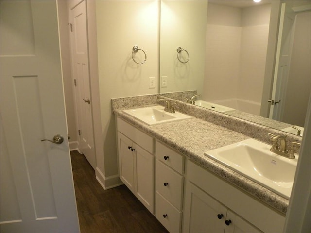 bathroom featuring hardwood / wood-style floors and vanity