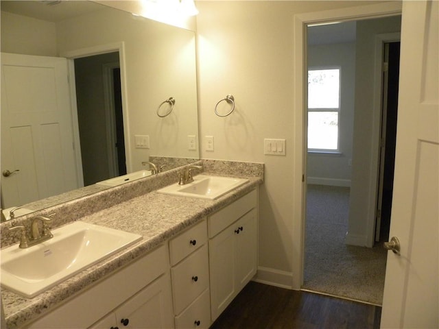 bathroom with vanity and hardwood / wood-style flooring