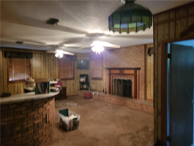 kitchen featuring carpet flooring, kitchen peninsula, and wooden walls