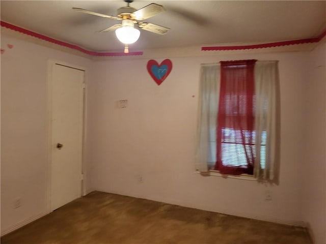 empty room featuring ceiling fan and carpet floors