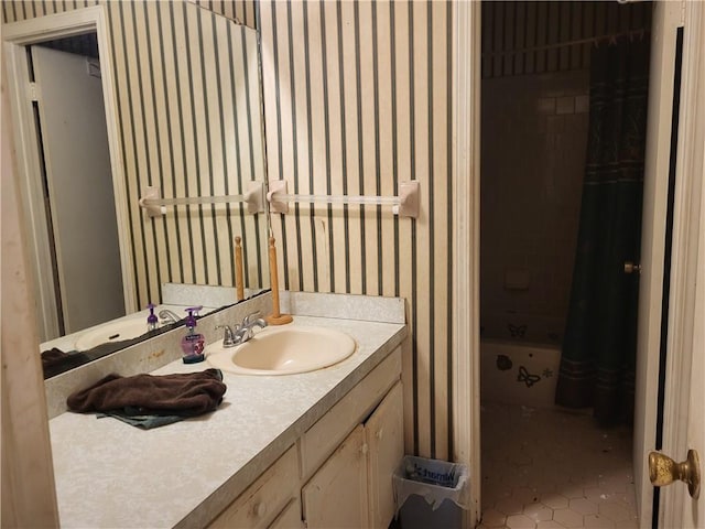 bathroom featuring tile patterned flooring and vanity