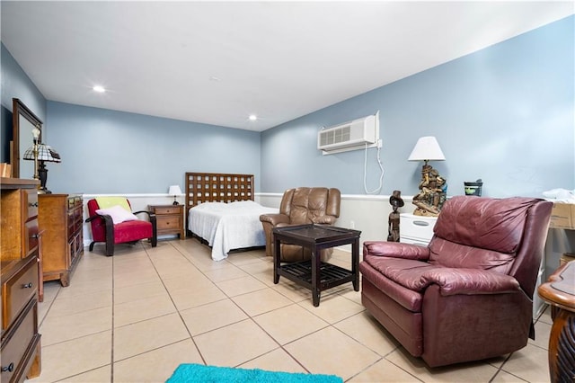 bedroom featuring a wall mounted air conditioner and light tile patterned flooring