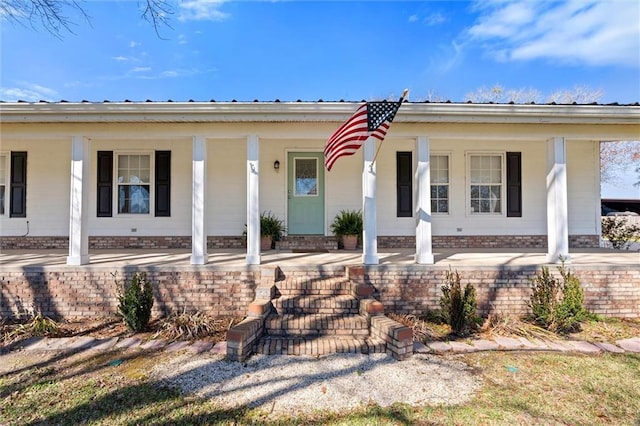 view of front of home featuring a porch and metal roof