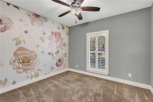 spare room featuring ceiling fan and carpet flooring