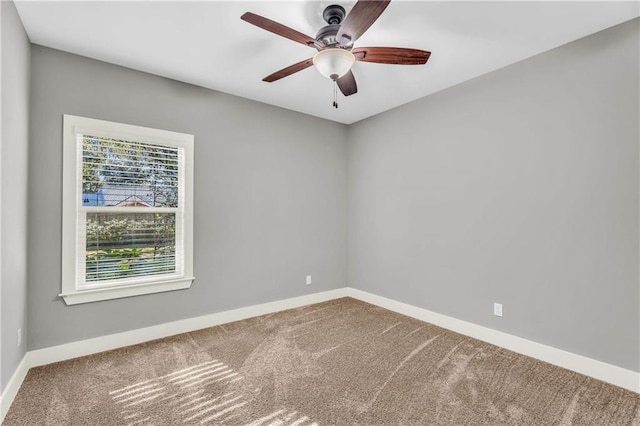 carpeted empty room with ceiling fan