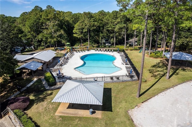 view of swimming pool with a lawn and a patio