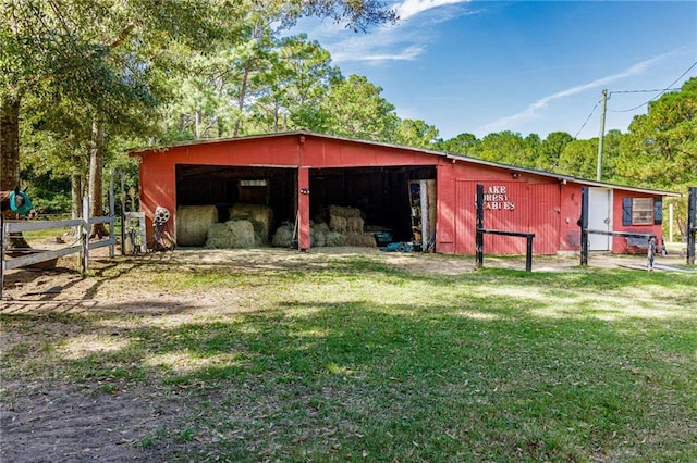 view of outdoor structure featuring a yard