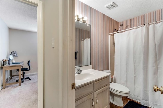 full bathroom featuring wallpapered walls, visible vents, toilet, a textured ceiling, and vanity