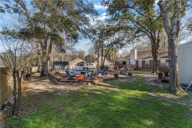 view of yard featuring a wooden deck