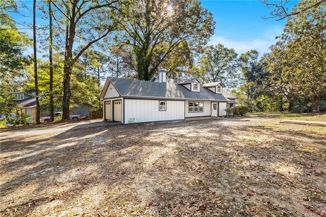 view of side of home with a garage