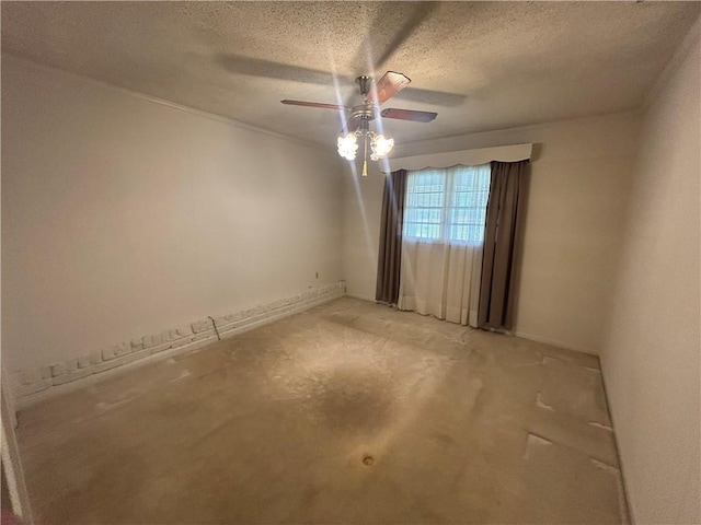 empty room featuring a textured ceiling and a ceiling fan