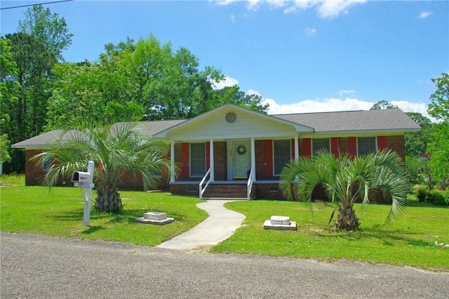 327 Alpine St, Mobile, AL 36611 - view of front of home featuring a front lawn, covered porch, and brick siding