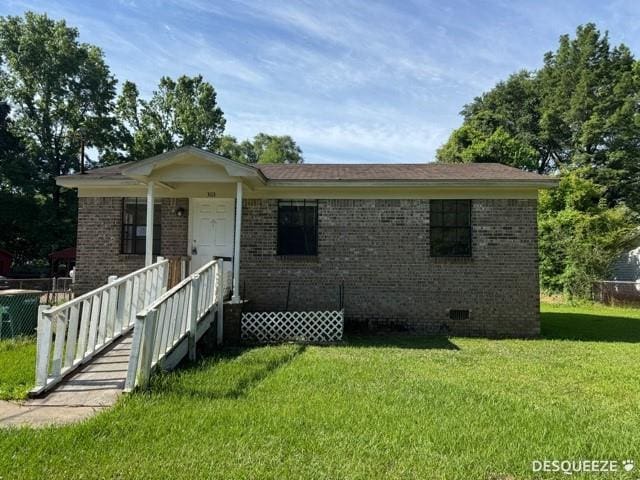303 Ruben Ave, Saraland, AL 36571 - view of front of home featuring a front yard, brick siding, and crawl space