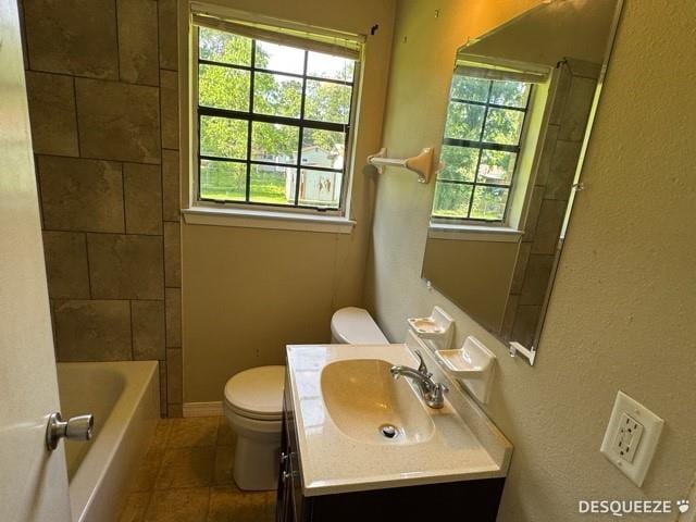 303 Ruben Ave, Saraland, AL 36571 - full bath featuring toilet, vanity, and tile patterned floors