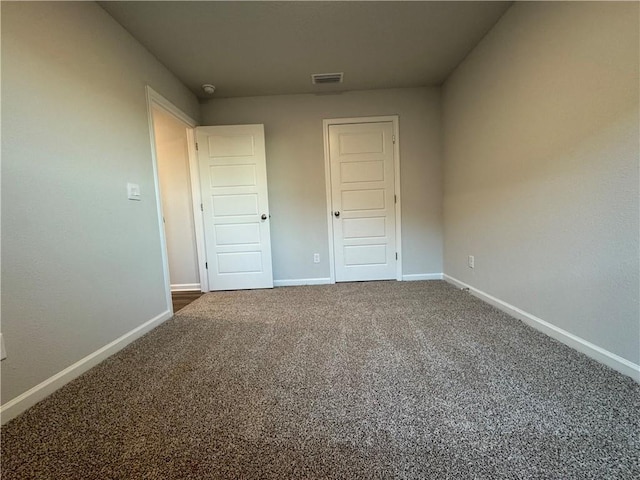 unfurnished bedroom featuring carpet