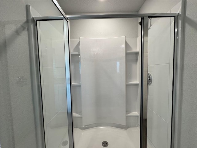 bathroom with an enclosed shower