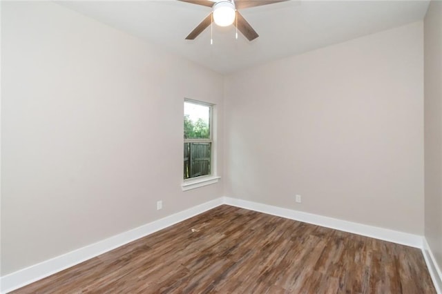 284 Magnolia Dr, Mobile, AL 36617 - empty room featuring dark wood-type flooring, baseboards, and a ceiling fan