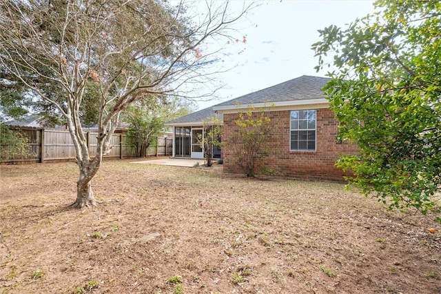 rear view of property featuring a patio