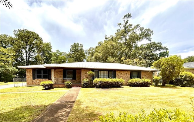 1113 Carre Dr W, Mobile, AL 36618 - view of front of home with a front lawn, a porch, and brick siding