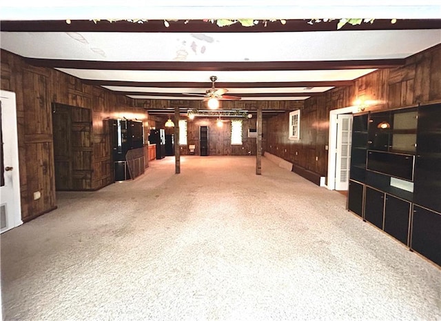 1113 Carre Dr W, Mobile, AL 36618 - below grade area featuring wood walls, a ceiling fan, and light carpet